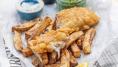 Homemade fish and chips with citrus seasoning and crushed peas