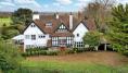 Look inside: Terry Wogan’s £3.75m home with tennis court, swimming pool, croquet lawn and orchard