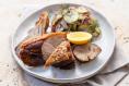 Crispy-skinned pork shoulder wedge with sauerkraut slaw