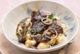 Gnocchi with slow-roasted lamb, crème fraîche and greens